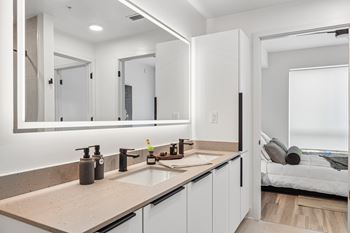 Dual bathroom vanities with quartz countertops